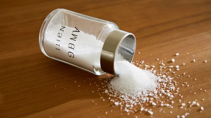 Overturned salt shaker on a kitchen table